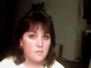 Jeannette taking a picture for a friend with her QuickCam