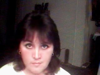 Jeannette taking a snapshot for a friend with her QuickCam