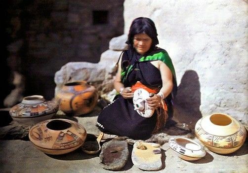 " THE GREATEST ARTIST OF HER TRIBE. This is Nanpeo the famous Hopi pottery maker, now nearly blind. But her gift for ceramic decoration is to be transmitted through her daughters who have been carefully instructed in the use of designs which have a religious symbolism as well as esthetic qualities. Nanpeo is wearing a typical Hopi costume."  Nat'l Geographic Vol XXX, p. 245. The Knott autochrome dates to 1916. Note B. Kramer plate 9.