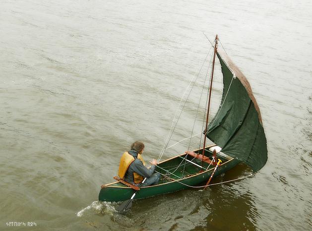 Sailing a sail canoe UP the Mississippi River in late Autumn. The "Q" canoe.
