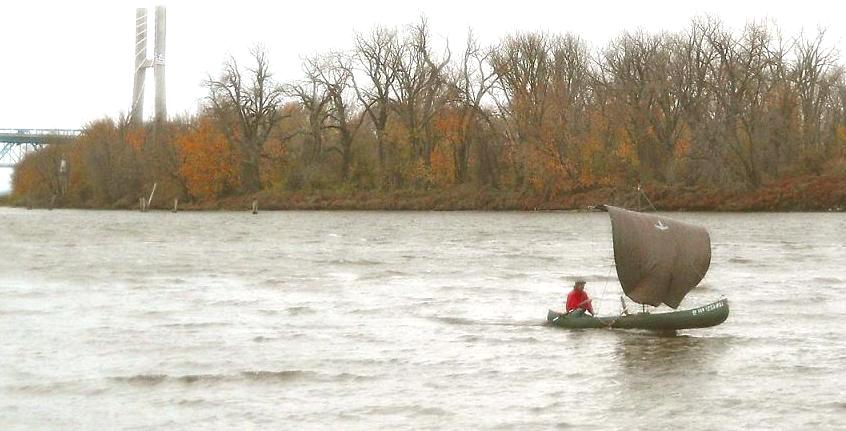 Sailing a sail-canoe UP the Mississippi River in November. Awesome !
