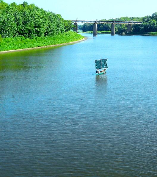 Sailing a sail-canoe UP the Mississippi River.
